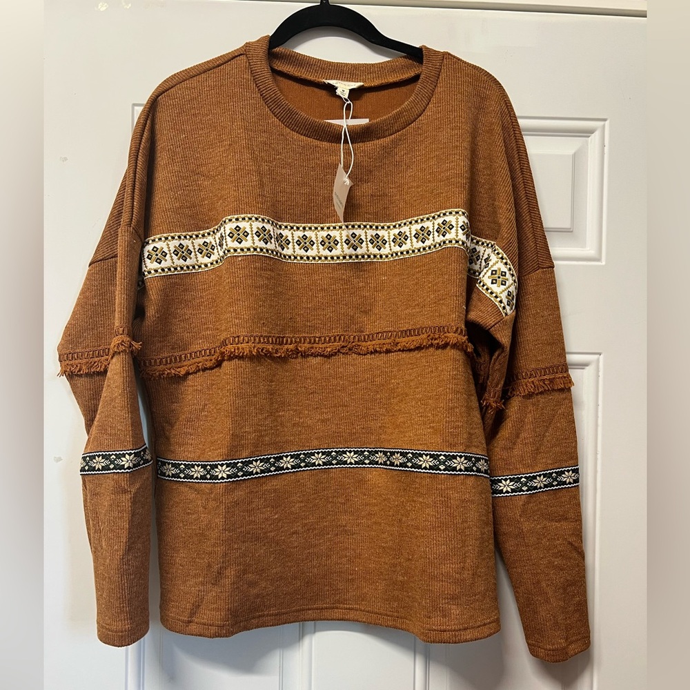 Andthewhy rust colored sweater with ribbon and fringedetails size medium!  NWT